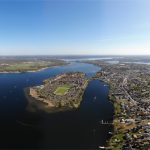 air; blue; havel; werder; aerial; drone; destination; boat; island on the river; aerial view; historical; trees; sight; landmark; sightseeing; historic; core city; island; history; bird eye view; garden; attraction; traditional; water sports; werder havel