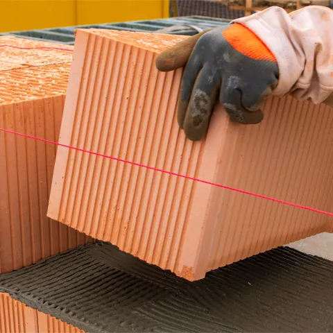 bricklayer at work at new house in construction